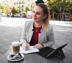 Young woman drinking coffee