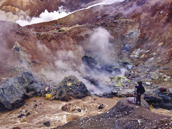 Man standing on volcanic mountain