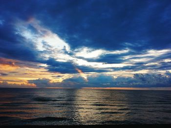 Scenic view of sea against cloudy sky