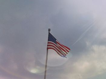 Low angle view of flag against sky