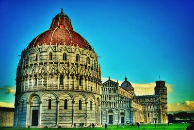 Low angle view of buildings against clear blue sky