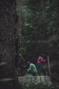 Rear view of women in forest