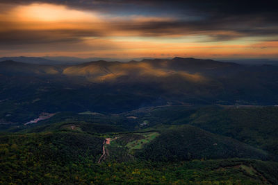 Scenic view of landscape against sky during sunset