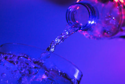 Close-up of water drop on glass