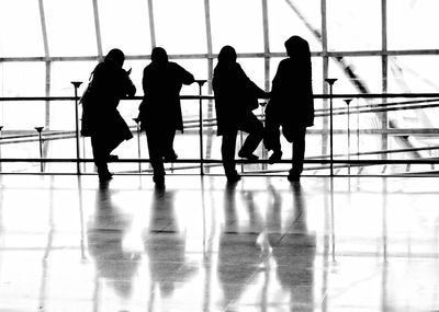 Women wearing hijab standing at airport