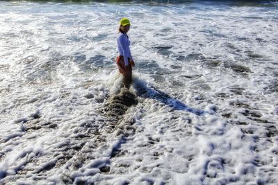 Full length of man surfing in sea