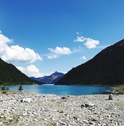 Scenic view of lake against blue sky