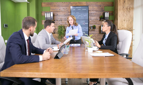 Business colleagues working in board room at office