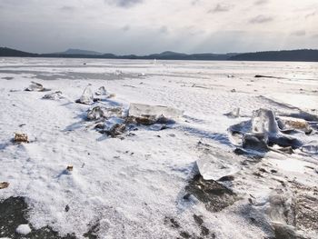 Scenic view of sea against sky during winter