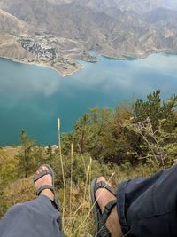 Low section of people on lake against mountains