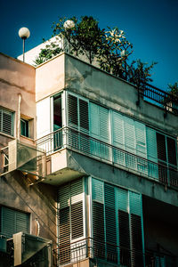 Low angle view of building against clear blue sky