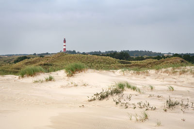 Panoramic image of the dunes of amrum with the lighthouse, germany