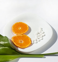 Close-up of orange slice in plate