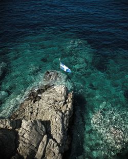 High angle view of rock in sea