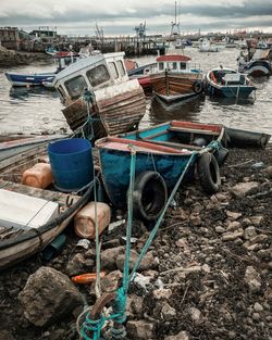 Fishing boats moored at harbor