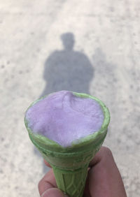Close-up of hand holding ice cream