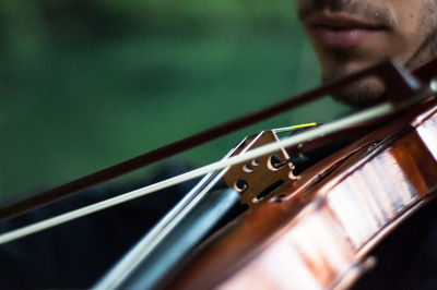 Close-up of man playing violin