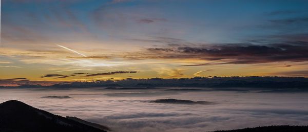 Scenic view of dramatic sky at sunset