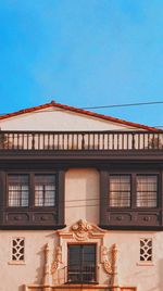 Low angle view of building against blue sky