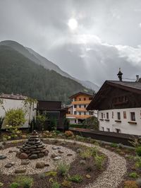 Village in the mountains against morning fog