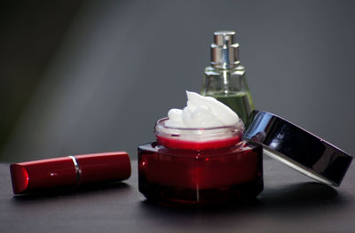 Close-up of red wine bottles on table