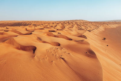 Scenic view of beach against clear sky