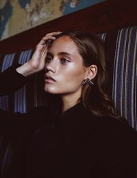 Portrait of young woman looking away