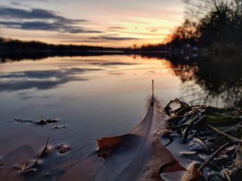 Scenic view of lake against sky during sunset