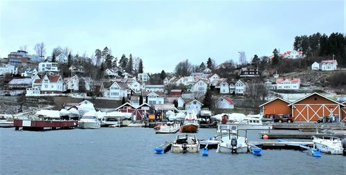 View of boats in harbor during winter