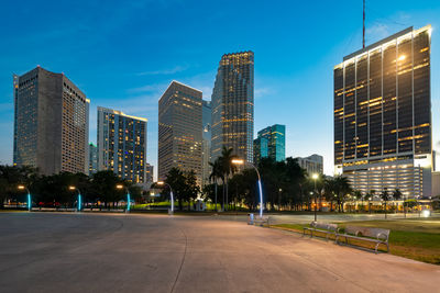Modern buildings in city against sky