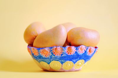 Close-up of oranges against white background