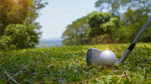 Low section of man playing golf