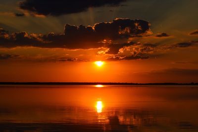 Scenic view of sea against romantic sky at sunset