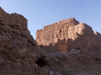 Low angle view of rock formation against clear sky