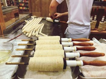 Midsection of man preparing food