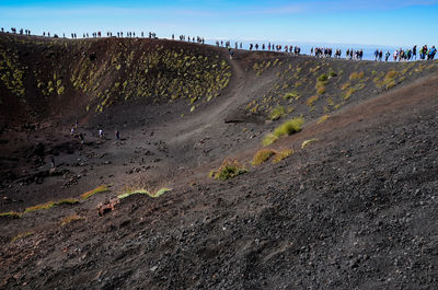 Aerial view of people on landscape against sky