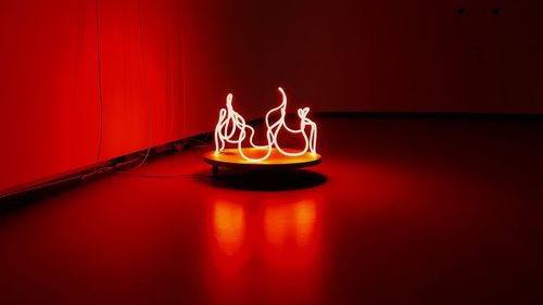 Red neon light fire sculpture 