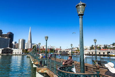 View of cityscape against blue sky