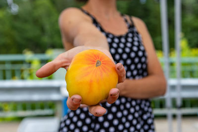 Midsection of woman holding ice cream