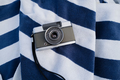 Film camera on the beach towel