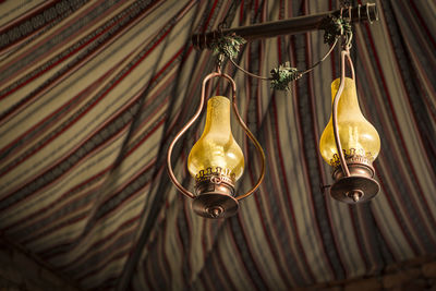 Low angle view of lanterns hanging in tent