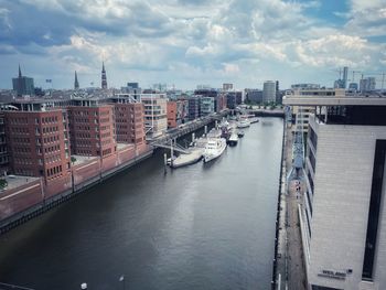 High angle view of river amidst buildings in city