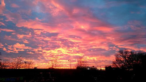 Low angle view of dramatic sky during sunset