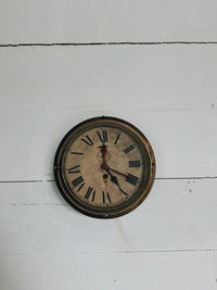 Low angle view of clock on wall