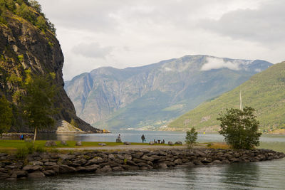 Scenic view of lake and mountains against sky