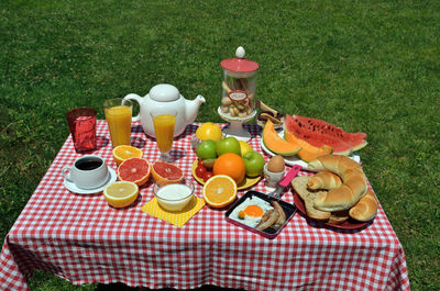 Rich breakfast or brunch with fresh coffee, domestic croissants, cookies, cereals and orange juice