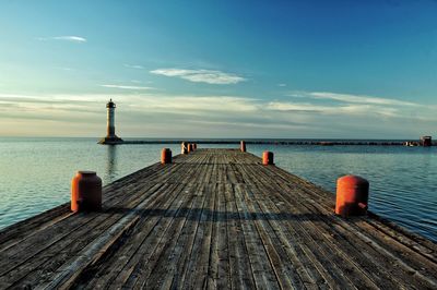 Pier over sea against sky