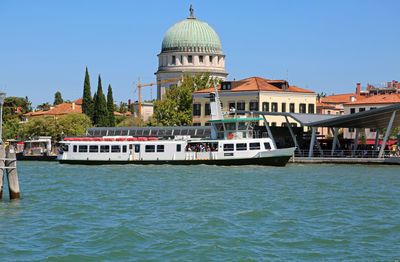 View of buildings in city against clear sky