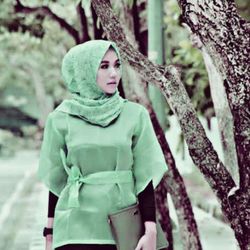 Portrait of teenage girl standing in forest