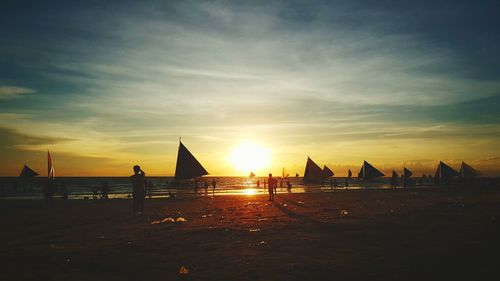 Scenic view of beach against sky during sunset